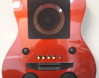 Guitar speaker # 165. This guitar has been repurposed into a wall hanging bluetooth speaker, Syncs with any device.