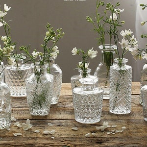 Creative Design Leave Shape Embossed Round Decoration Clear Glass Vase for  Flowers - China Glass Bottle, Custom Glass Bottle