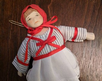 Vintage Hand Painted Miniature Porcelain Doll Ornament With Red Bonnet Apron Movable Arms