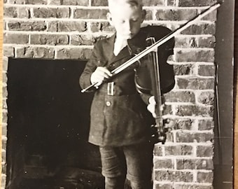 Vintage Postcard of Boy Playing the Violin in front of a Brick Fireplace