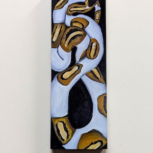 May include: A rectangular painting on a vertical panel featuring a coiled snake with a light blue and white body patterned with dark brown and gold patches. The snake is positioned against a solid black background, creating a high contrast.