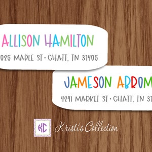 May include: Two white oval-shaped return address labels with colorful text. The top label reads "ALLISON HAMILTON 2025 MADLE ST. CHATT, TN 31405". The bottom label reads "JAMESON ABROMS 4241 MARKET ST. CHATT, TN 31405". The labels are on a woodgrain background. The text "Kristi's Collection" is at the bottom of the image.