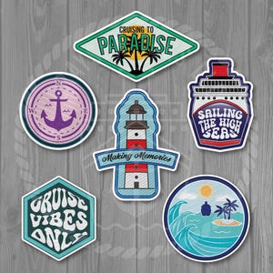 May include: Six colorful embroidered patches with nautical themes. The patches feature a lighthouse, an anchor, a cruise ship, a palm tree, and waves. The text on the patches includes "Cruising to Paradise", "Sailing the High Seas", "Making Memories", "Cruise Vibes Only", and "Shroom Queens".
