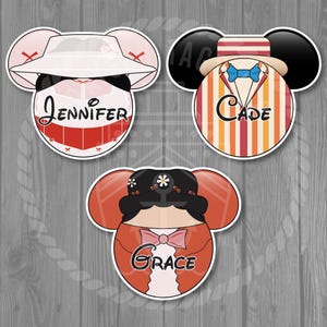 May include: Three cartoon character stickers with mouse ears. One has a white hat and the name "Jennifer". Another has a striped outfit and the name "Cade". The third has a floral headpiece and the name "Grace".