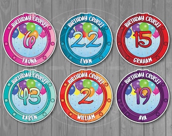 May include: Six colorful round birthday party decorations with a porthole design. Each decoration has a number, a name, and the words "Birthday Cruise".