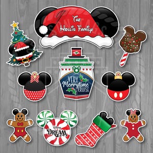 May include: A collection of Christmas-themed stickers featuring Mickey Mouse and Minnie Mouse. Designs include a Santa hat with "The Hollis Family" text, a Christmas tree, a cruise ship, gingerbread people, and candy canes. The stickers are in red, black, white, and green.