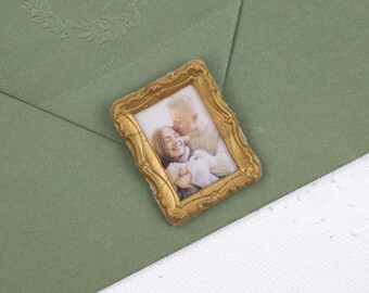 May include: A green envelope with a gold-framed photograph of a couple on the front. The envelope has a decorative embossed design with the letters "C & J" in a circle.