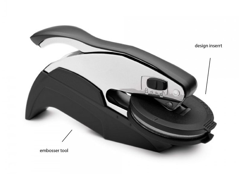 May include: A black and silver embosser tool with a lever handle. The tool has a round design insert that can be changed.