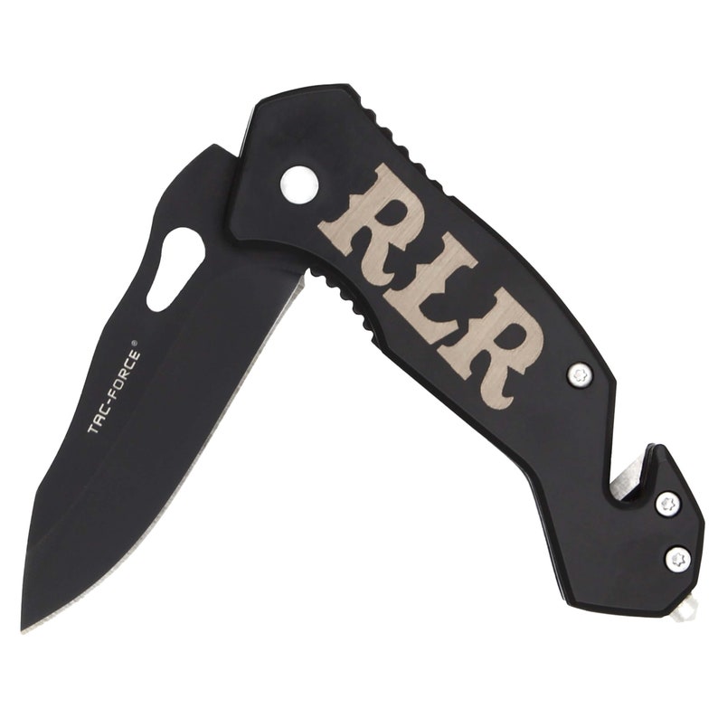 May include: Black pocket knife with a silver RLR logo on the handle. The knife has a safety feature and a bottle opener.