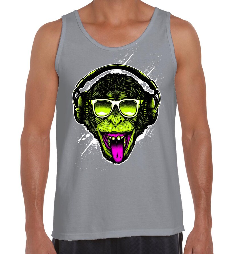 May include: A grey tank top featuring a green monkey wearing sunglasses and headphones. The monkey has a pink tongue sticking out.