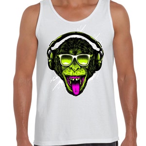 May include: A white tank top featuring a green monkey wearing sunglasses and headphones. The monkey has its tongue sticking out and is smiling.