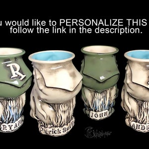 May include: Four ceramic mugs with different designs and names. The mugs are green, white, and brown with blue accents. The names on the mugs are Ryan, Patrick Sullivan, John, and Andrew.