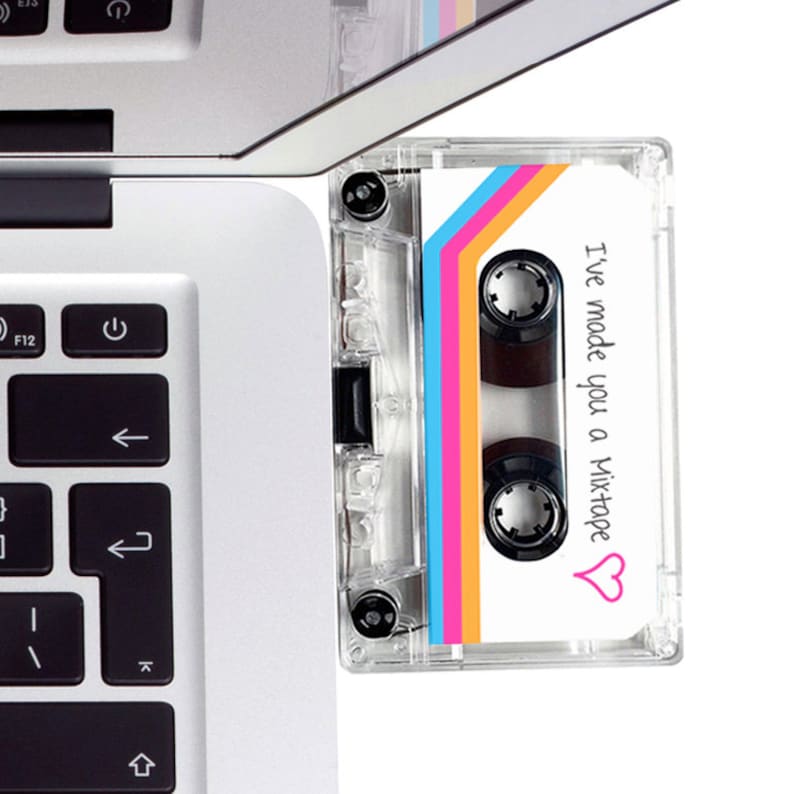 May include: A clear plastic cassette tape with a white label. The label has a rainbow design and the text "I've made you a mixtape" with a pink heart.