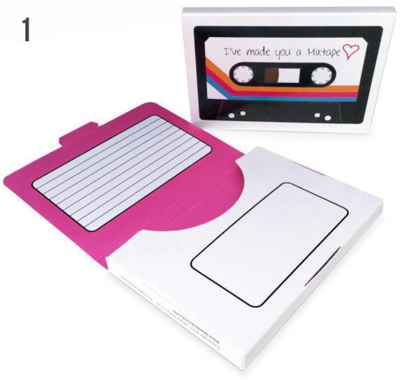 May include: A pink and white card shaped like a cassette tape with the text "I've made you a Mixtape" and a red heart. The card has a flap that opens to reveal a blank space for writing a message.