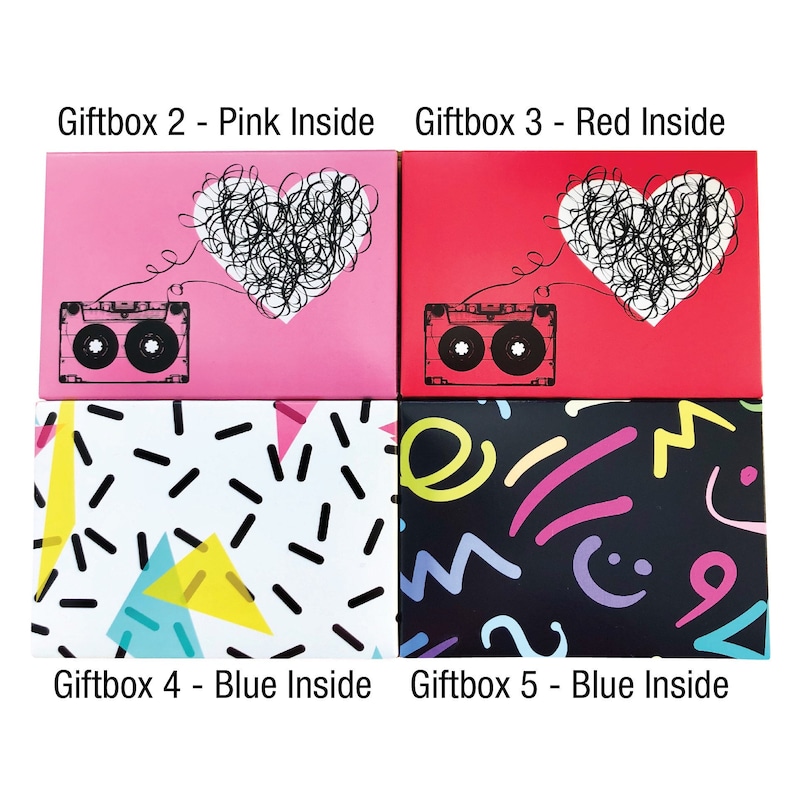 May include: Four gift boxes with different designs. The top two boxes have a pink and red background with a heart and a cassette tape. The bottom two boxes have a white and black background with geometric shapes.