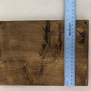 May include: A brown wooden sign with the text "TatzDecoArt" and "WESTCOTT" printed on it. The sign is approximately 18 inches tall and 12 inches wide.