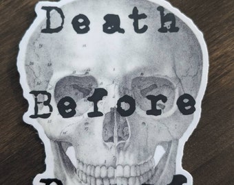 May include: A black and white sticker of a skull with the text "Death Before Decaf" printed on it.