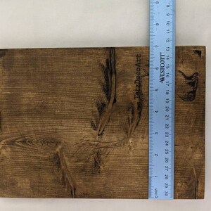 May include: A brown wooden sign with the text "TatzDecoArt" and "WESTCOTT" printed on it. The sign is approximately 18 inches tall and 12 inches wide.