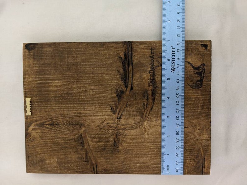 May include: A brown wooden sign with the text "TatzDecoArt" and "WESTCOTT" printed on it. The sign is approximately 18 inches tall and 12 inches wide.