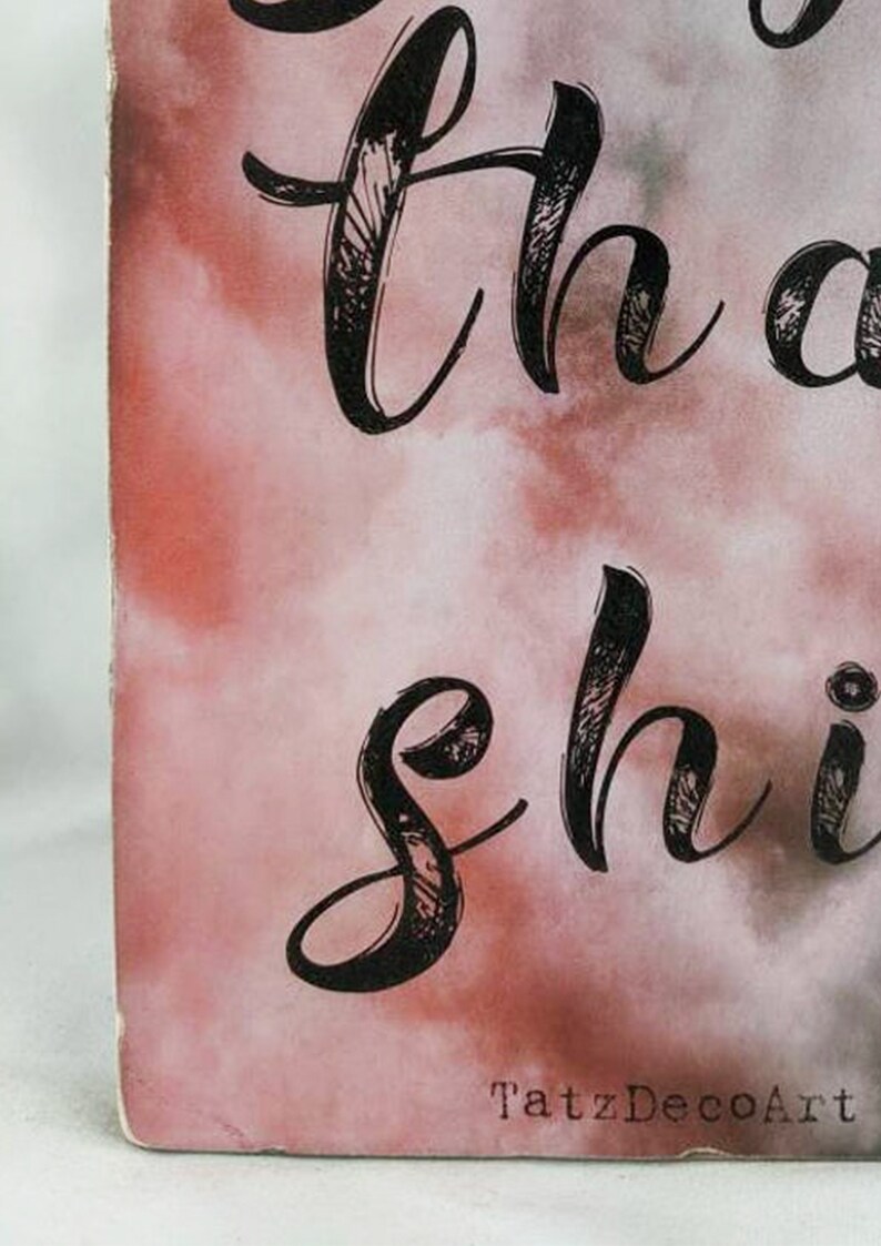 May include: Close-up of a pink and white watercolor background with black calligraphy that reads "Let your light shine". The text "TatzDecoArt" is visible in the bottom right corner.