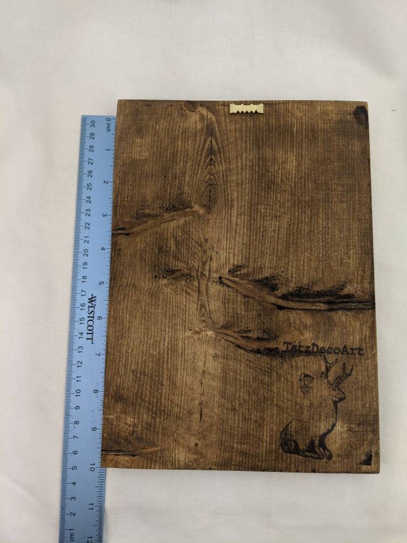 May include: A dark brown wooden sign with a deer silhouette and the text "TatzDecoArt" burned into the wood.