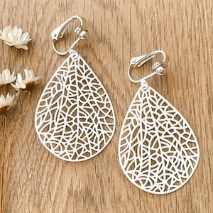 White Clip on Earrings: simple and light no hole earrings. A great accessory to match any colour