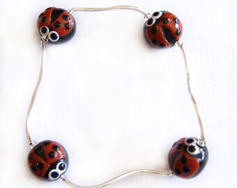 Bracelets with fimo and 925 silver ladybirds