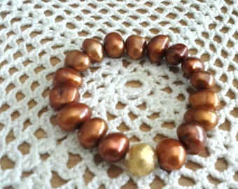 Bracelet sophistiqué avec perles et boule avec feuille d'or