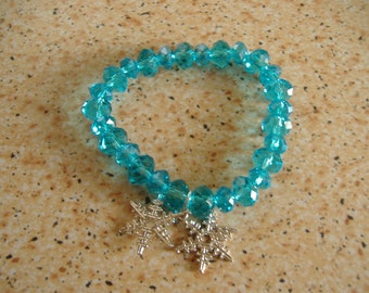 Pulsera con cristal azul y colgante estrellas