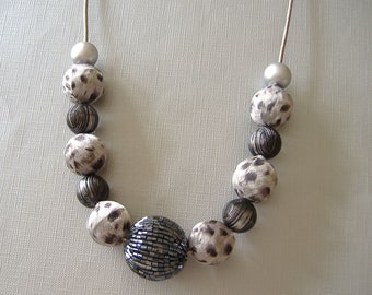 Silver necklace with animal print