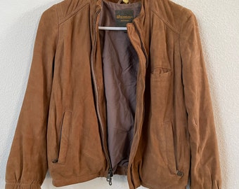 May include: A brown suede jacket with a zipper closure and a label that reads "Wrangler" on the inside.