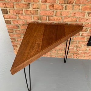 Tall corner triangle table with black hairpin legs poplar wood stained honey brown