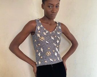 1960s silver lurex knit top, pieces of metal and studs attached, sleeveless, french made