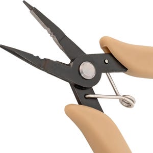 May include: Needle-nose pliers with a black metal finish and serrated jaws. The tool features beige, ergonomic rubberised handles and a silver-toned metal coil spring mechanism located between the handles for tension control and ease of use.