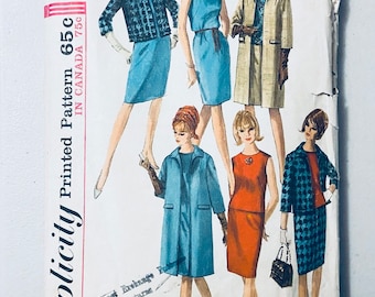 May include: Vintage Simplicity sewing pattern number 6197 for a dress and jacket. The pattern is for a size 14, bust 34. The pattern shows five different styles of dresses and jackets, including a blue dress with a white collar, a red dress with a white collar, and a blue jacket with a white collar.