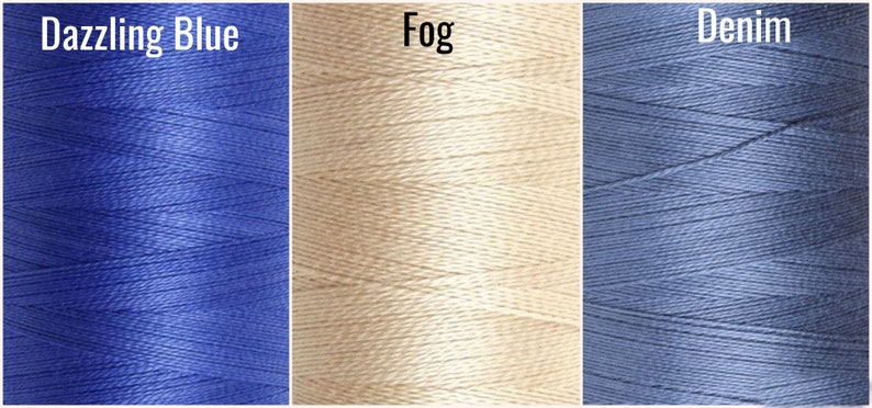 May include: Three spools of thread in different colors: Dazzling Blue, Fog, and Denim.