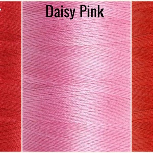May include: Three spools of thread in different colors: Chili Pepper, Daisy Pink, and Coral Red.