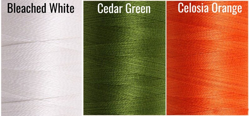 May include: Three spools of thread in different colors: bleached white, cedar green, and celosia orange.