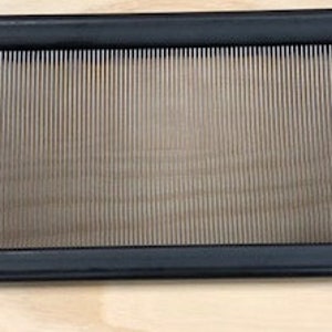 May include: A black metal loom with a silver metal warp. The loom is 12 inches wide and 18 inches long. The loom is used for weaving.