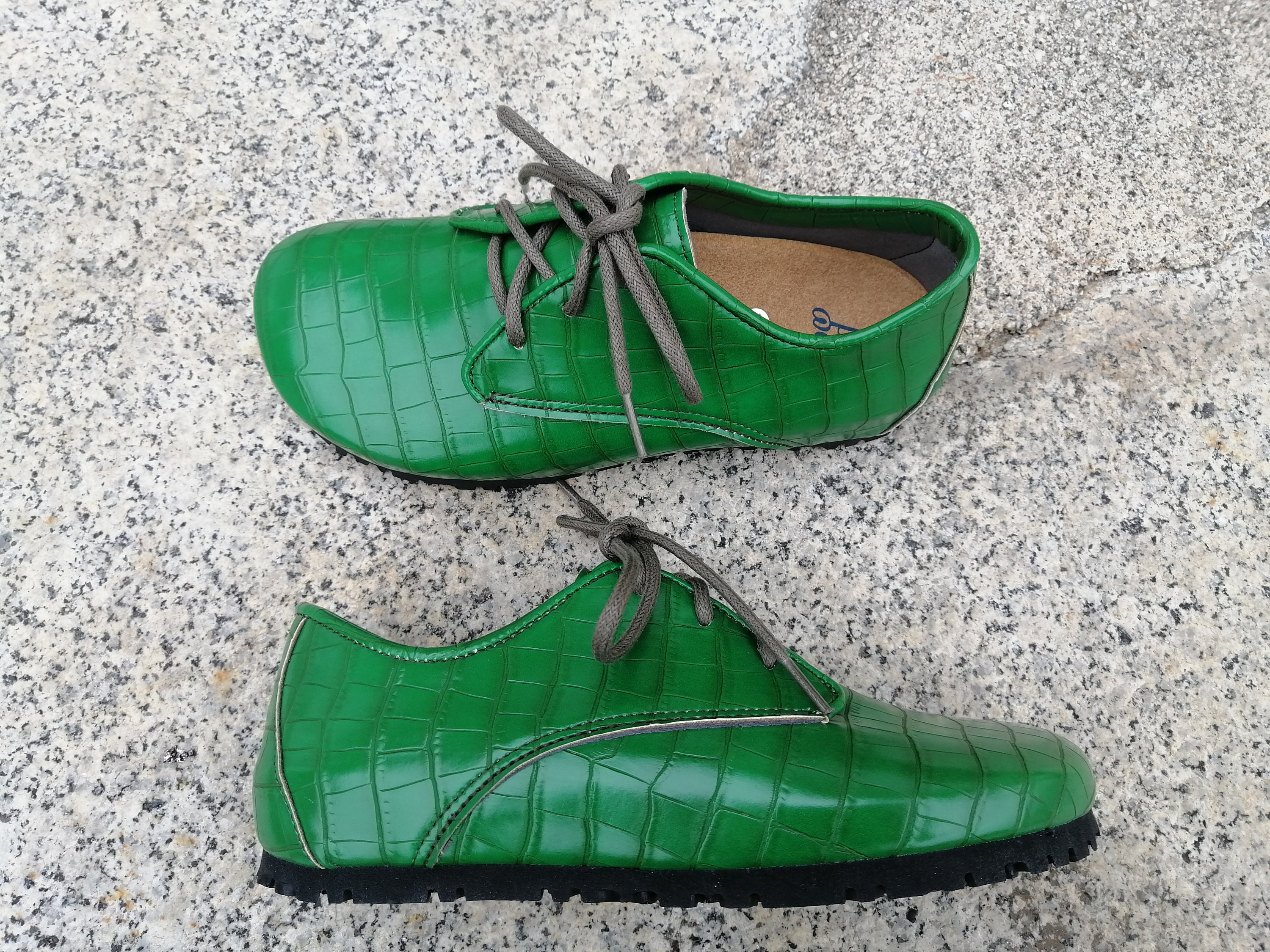 green leather trainers