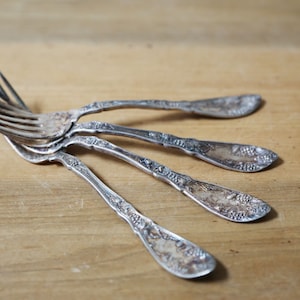 Silver plated forks, set of 4 Wm A Rogers grape pattern from 1910