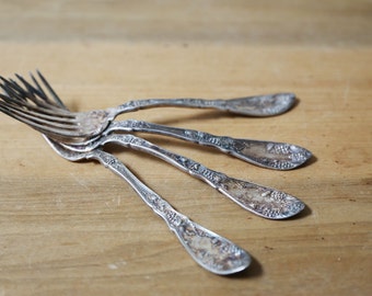 Silver plated forks, set of 4 Wm A Rogers grape pattern from 1910