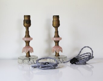 Pair of clear and pink glass boudoir lamps with black and white twisted fabric cord