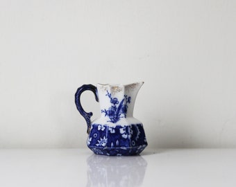 Flow Blue Porcelain Pitcher with gold foiled accents