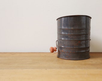 Antique metal flour sifter