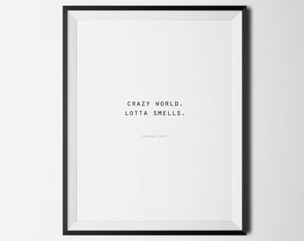May include: A black framed print with a white background and the text "CRAZY WORLD. LOTTA SMELLS." with the name "MICHAEL SCOTT" in smaller font below.