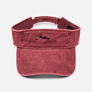 May include: A red, distressed, cotton visor with a black outline of the Turks and Caicos Islands.