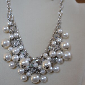 Fun, sparkly, chain mesh, faux pearl, and crystal bead necklace. Perfect for winter parties or anytime of year.