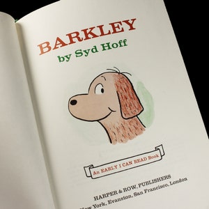 May include: A book cover with the title "Barkley" by Syd Hoff. The cover features a cartoon illustration of a brown dog with a white face and a green background. The text "An Early I Can Read Book" is printed on a white ribbon.
