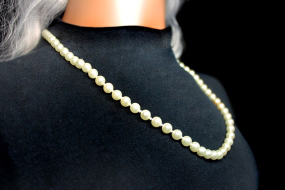 Long strand of pearls costume jewelry clearance